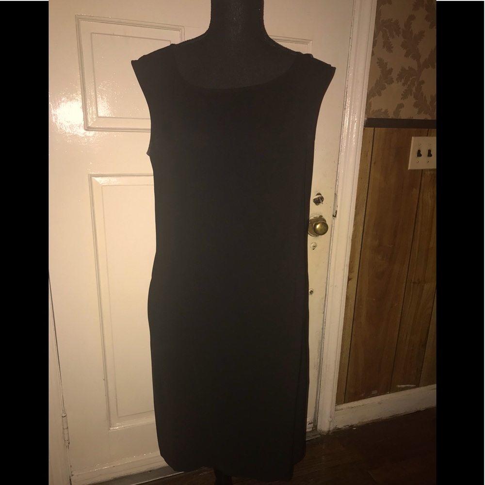 Woman’ black dress with pockets on each side and pleats n the back